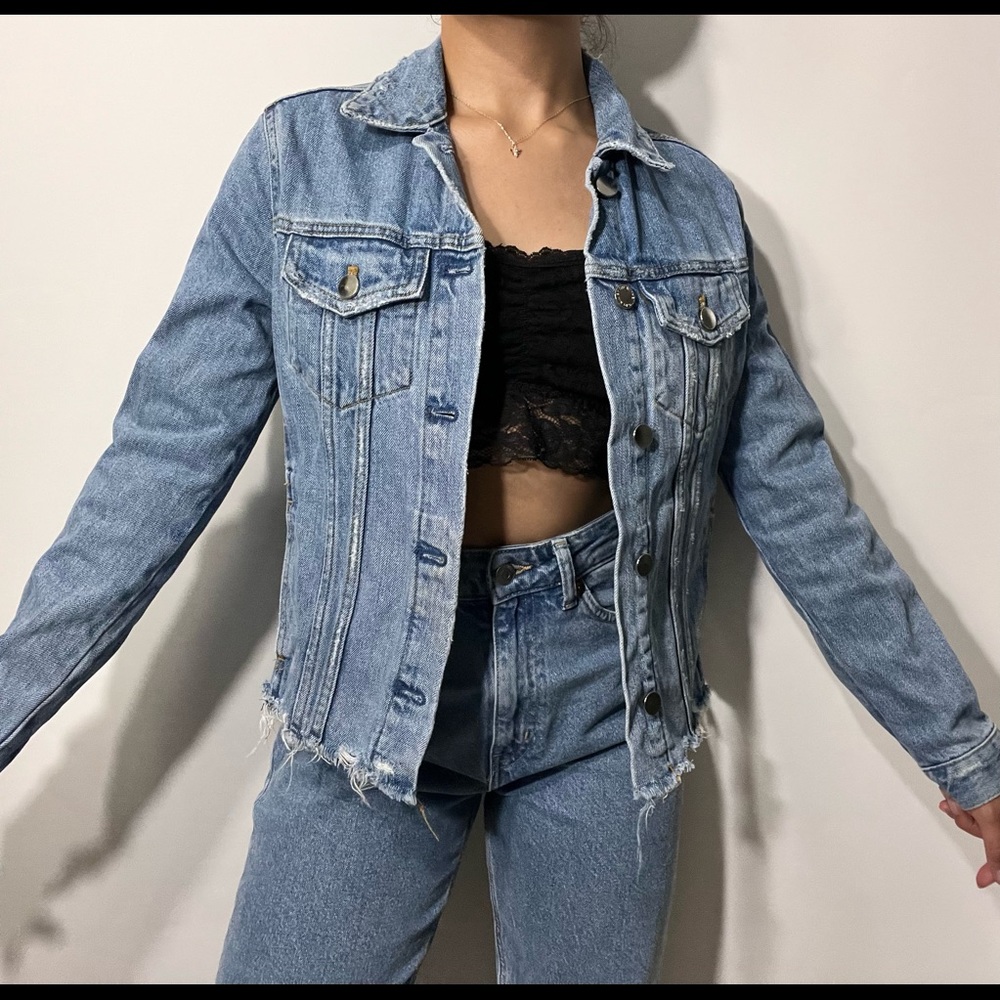Ripped light blue jean jacket from Zara